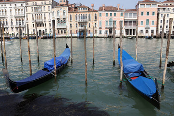 Fototapeta na wymiar View of gondolas and poles in the canal grande from Campo di Salute - Venice - Italy
