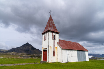 Fototapeta na wymiar The village church in Hellnar, an old fishing village in the Snaefellsnes peninsula of Iceland