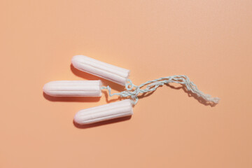 hygienic tampons on a light background, the concept of female care during critical days