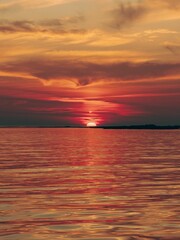 Vertical of red sunset over a tranquil sea