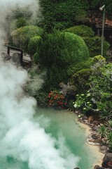 Fototapeta na wymiar Vertical shot of the Hot Springs in the daylight in Beppu, Japan