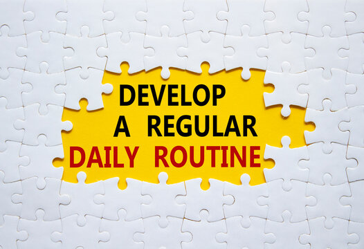 Daily routine symbol. Concept words Develop a regular daily routine on white puzzle. Beautiful yellow background. Business and Develop a regular daily routine concept. Copy space.