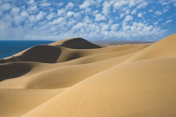 Fototapeta na wymiar Scenic view of the dunes in a desert in Namibia