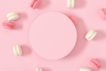 Cake macaroons or macaroon on pink background, round, circle for text , colorful almond cookies, macaroon for sweet break mock up. Flat lay, top view