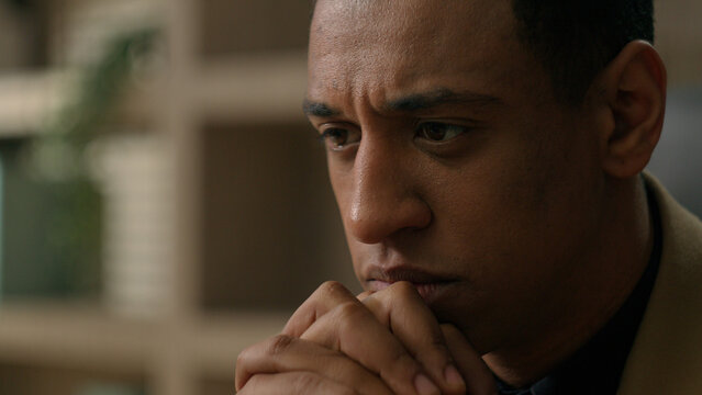 Close up thoughtful African American man confused puzzled businessman business employer leader thinking idea pensive think deep in thoughts ponder question dreaming search problem difficult solution