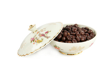 Porcelain box with chocolate dragee isolated on a white . German vintage porcelain.