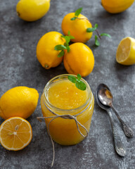 Freshly made homemade lemon jam in glass jars.