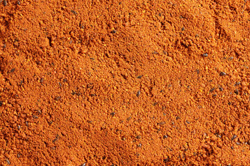 Orange background made of dried sea buckthorn powder