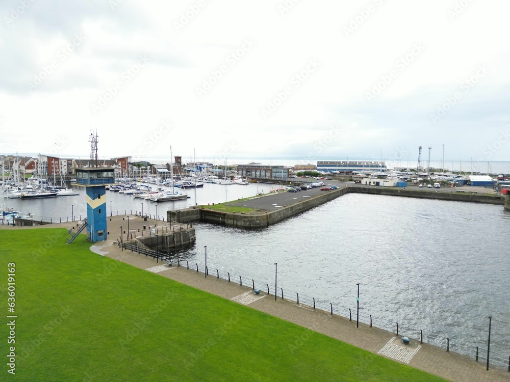 Wall mural Stunning aerial view of Ardrossan marina, showing a vast array of colorful boats in Scotland