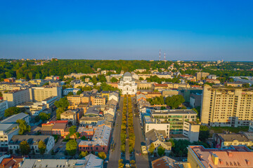 Kaunas city center and Freedom Avenue, Laisves aleja in Lithuania. Aerial drone view of alley in summer.