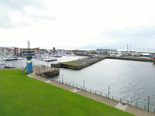 Fototapeta premium Stunning aerial view of Ardrossan marina, showing a vast array of colorful boats in Scotland