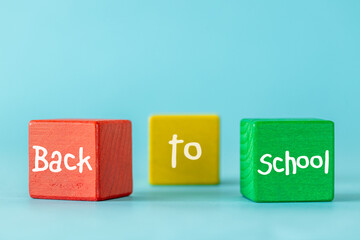 Back to school words written on colorful blocks, Beautiful blue background, Positive education concept