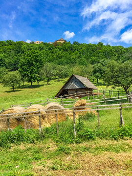 House about sheep and hay, behind ruin of Tochnik Castle. Old stronghold, Czech