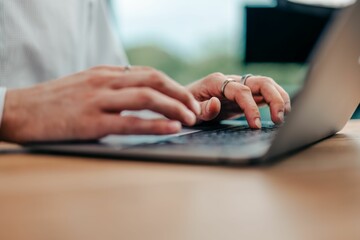 businessman typing something on his keyboard