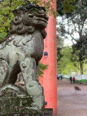 Majestic stone lion statue in Nara Park, Japan