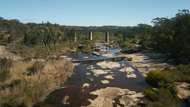Beautiful view of the Quart Pot Creek Rail Bridge with forest trees in Stanthorpe, Australia