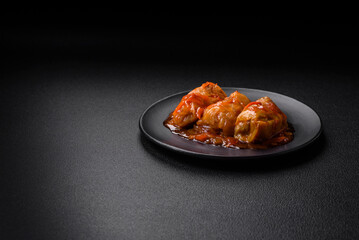 Delicious dolma in tomato sauce with carrots, onions, salt, spices and herbs