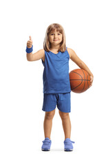 Girl holding a basketball and gesturing thumbs up