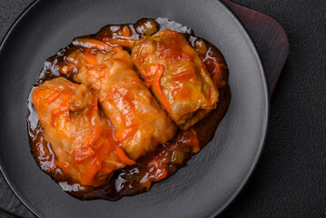 Delicious dolma in tomato sauce with carrots, onions, salt, spices and herbs