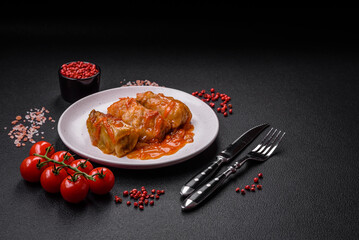 Delicious dolma in tomato sauce with carrots, onions, salt, spices and herbs