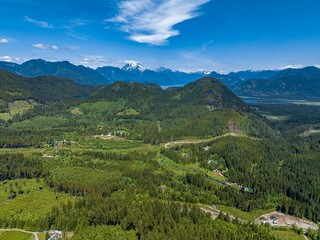 Fototapeta na wymiar Aerial view of a breathtaking natural landscape, featuring a lush green valley in Mission, Canada