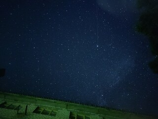 A house against the background of a dark night starry sky