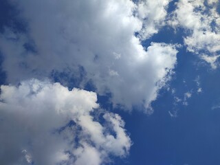 Cloudy sunny blue summer sky