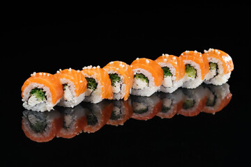 Philadelphia classic with salmon with lightly salted salmon, cream cheese, cucumber, decorated with microgreens, which is on a mirrored black surface