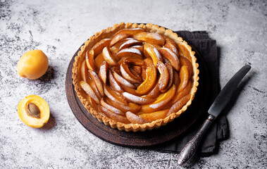 Apricot tart with sugar sprinkle in a plate