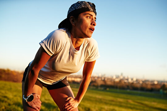 Female Runner in park during golden hour
