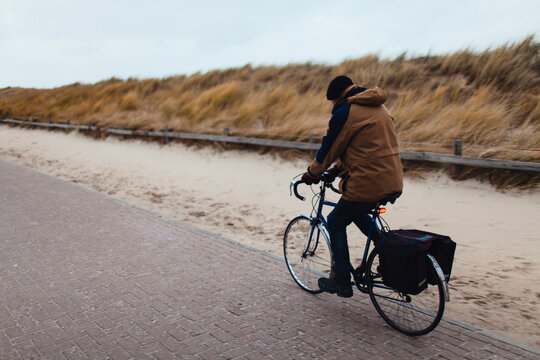 Man riding the bicycle in extreme  weather 