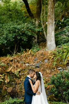 A Happy Wedding Couple Kisses