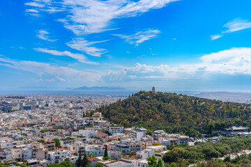 Fototapeta na wymiar Panorama of Athens with Acropolis hill, Greece. Famous old Acropolis is top landmark of Athens. Skyline of Athens city