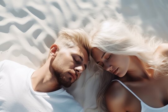 Dreamy Rest: Top-Down View of Blond Man and Woman Sleeping on Cloud-like White Bed, Enjoying Serene Summer Nights and the Blissful Comfort of Perfect Sleep for Good Dreams and Wellness