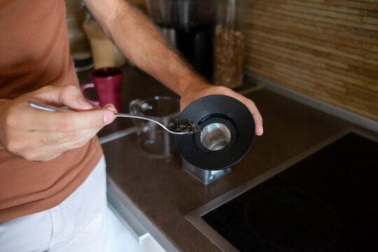 Close up of a male model making tea at home