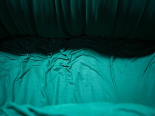 Green cloth draped over the floor