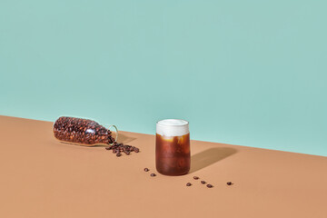 Tasty ice coffee with milk with cream cheese poured over