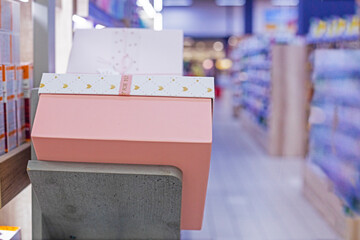 gift wrappings on the shelves in the supermarket. Gift for the holiday