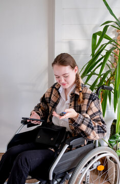 woman with disability holding keys from the apartments