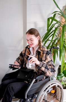 woman with disability holding keys from the apartments