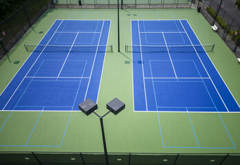 Blue and green pickleball tennis courts from above