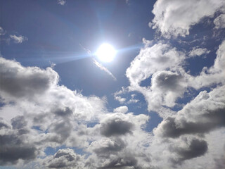 White clouds over blue sky background. Fluffy cumulus cloudscape