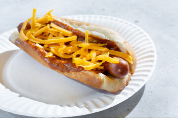A view of a chili cheese dog.