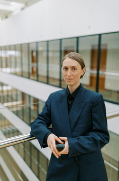 Business Woman Wearing Man Classic Suite With  Retro Cellphone 