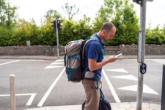 Traveler checking the map on his phone