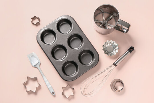 Baking form and utensils on beige background - Powered by Adobe