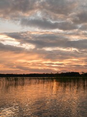 Closeup of a beautiful and vibrant sunset above a tranquil body of water