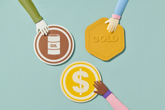 Hand with oil, money and gold as concept of oil exports