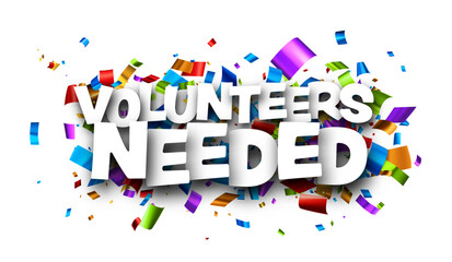 Volunteers needed sign over colorful cut out foil ribbon confetti background..