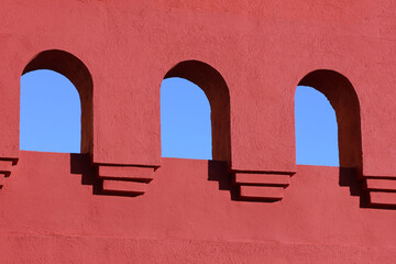 Pink facade with arches